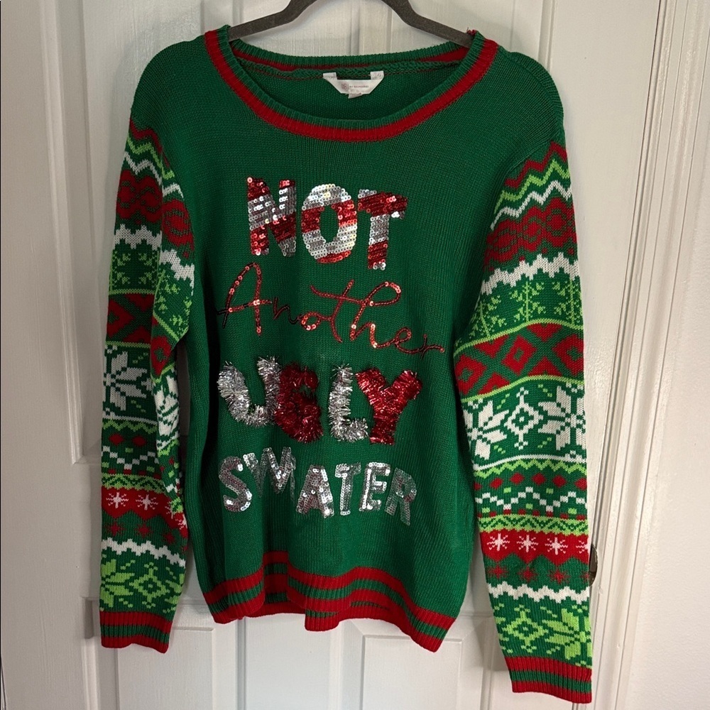 No Boundaries Holiday Ugly Sweater,Bells,Sequins. 
Says not another ugly sweater